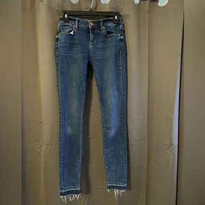 Frayed ends slightly distressed denim
